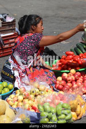 Antigua Municipal market, Guatemala. Fruit stalls displaying a variety of fresh local produce. Bustling , busy market in Antigua near the bus station. Stock Photo