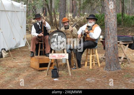 Olustee, Florida, USA - February 16, 2020: Band 7 lbs of bacon at Olustee Re-enactment in Florida 2020. Musicians playing authentical music. Civil war Stock Photo