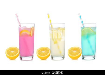 Cold, colorful summer lemonade drinks. Pink, yellow and blue colors in tall glasses with lemons isolated on a white background. Stock Photo
