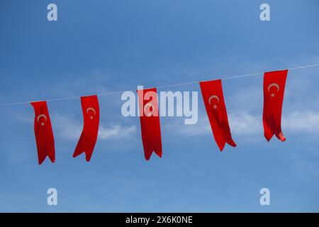 Turkish national flags with white star and moon in sky Stock Photo