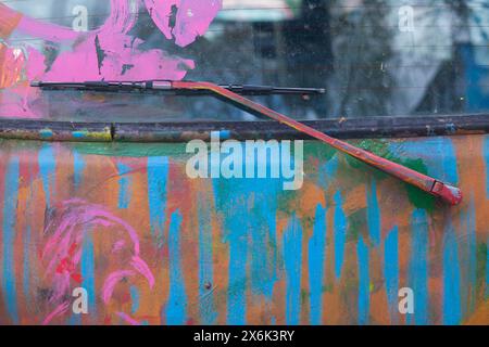 Windscreen wiper, colourfully painted vintage car, colour surface, Germany, Europe Stock Photo