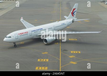 Hong Kong, 9 April 2024: China Eastern Airliners Airbus A330 airplane at Hong Kong Airport Stock Photo