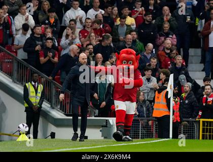 Manchester, UK. 15th May, 2024. Erik ten Hag manager of Manchester United welcomed by the Manchester United mascot Fred the Red during the Premier League match at Old Trafford, Manchester. Picture credit should read: Andrew Yates/Sportimage Credit: Sportimage Ltd/Alamy Live News Stock Photo