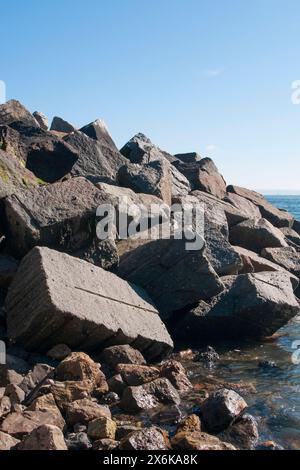 large rocks boulders form the new sea defences along the foreshore ...