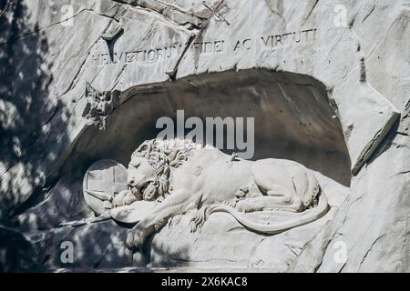 Lucerne, Switzerland - August 10, 2023: The Lion Monument, a rock relief in Lucerne, Switzerland, designed by Bertel Thorvaldsen and hewn in 1820–21 b Stock Photo