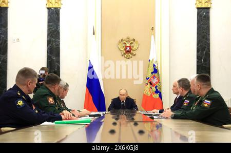 Moscow, Russia. 15th May, 2024. Russian President Vladimir Putin chairs a meeting with commanders of the military districts at the Kremlin, May 15, 2024, in Moscow, Russia. Credit: Vyacheslav Prokofyev/Kremlin Pool/Alamy Live News Stock Photo