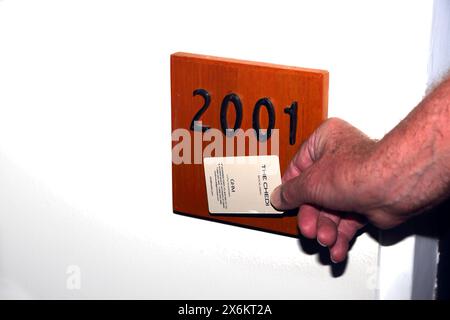 Man Using Contactless Keycard to Enter Hotel Room The Chedi Hotel Muscat Oman Stock Photo