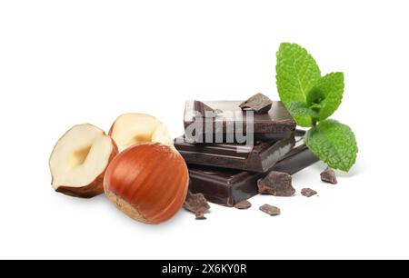 Dark chocolate and hazelnuts isolated on white Stock Photo