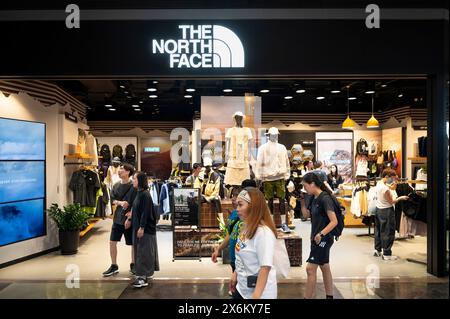 Hong Kong, China. 15th May, 2024. Shoppers walk past the American outdoor clothing brand, The North Face, store in Hong Kong. (Photo by Sebastian Ng/SOPA Images/Sipa USA) Credit: Sipa USA/Alamy Live News Stock Photo