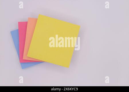 Post Notes colorful on white background isolated yellow peach pink blue colors Stock Photo