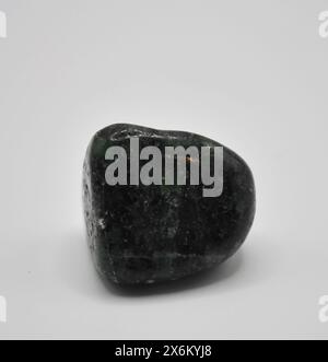 Close-up of a Polished Green Black Zoisite Palm Smooth Stone Stock Photo