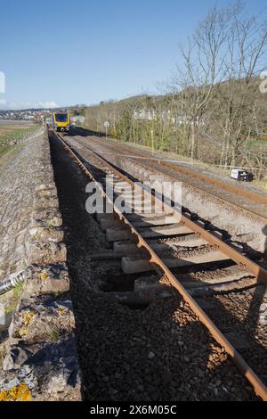 24/3/24 Grange Over Sands, Cumbria. Northern Rail class 195 trains that derailed on 22 March after a sink-hole opened under the line in the foreground Stock Photo