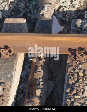 Rail Accident investigation branch tag on  water pipe damaged by a tamping machine at the site of the train derailment at Grange Over Sands March 2024 Stock Photo