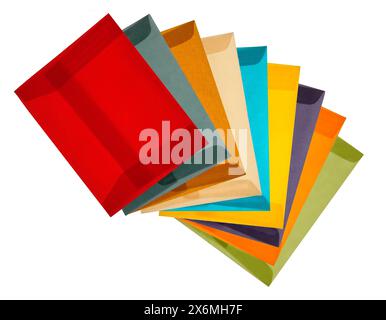 A still life arrangement of vibrant vellum envelopes in various colors like red, blue, yellow, green, and purple neatly arranged on a clean white back Stock Photo