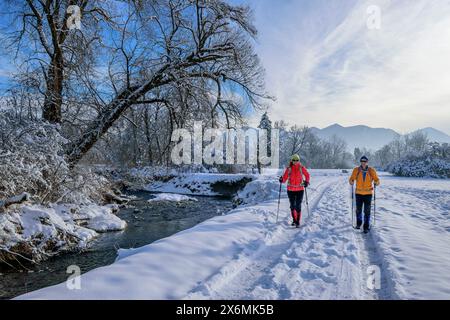 Man and woman walking along the stream through the Murnauer Moos, Murnau, Upper Bavaria, Bavaria, Germany Stock Photo