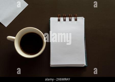 Creative Work Table, With A Notepad, Colored Pencils And A Cup Of Coffee Stock Photo
