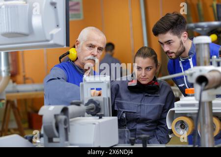 man and woman with machine cnc Stock Photo