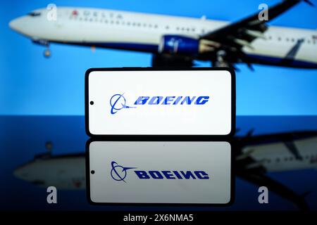 The Boeing company logo shown in screen. Aerospace company Stock Photo