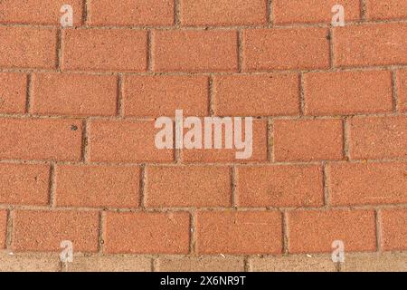 Red brick pavement texture with a regular, rectangular pattern. Stock Photo