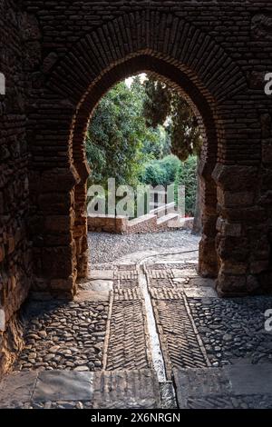 Arched gateway to the Alcazaba fortress of Malaga, Andalusia in southern Spain, with distinctive Moorish design. Stock Photo