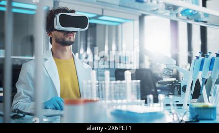 Futuristic Medical Research Laboratory: Research Scientist Wearing Virtual Reality Headset, Does Augmented Reality Research Using Smart Gestures. Big Data AI Biotechnology Research in Progress Stock Photo