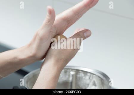 a woman making cookie dough in the kitchen Stock Photo