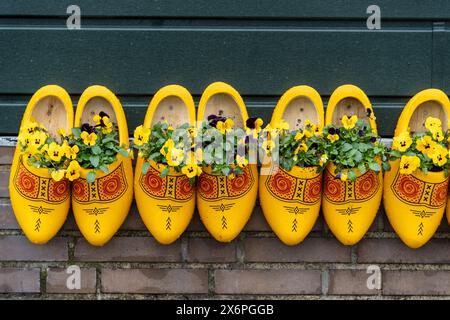 traditionally decorated yellow clogs, Zaanse Schans, Zaanstad Municipality, European Route of Industrial Heritage, Netherlands. Stock Photo