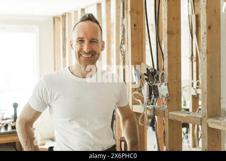 male electrician works working on a old house Stock Photo