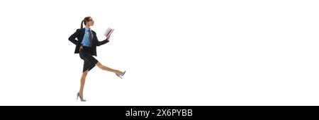 Businesswoman team leader in formal wear walking and looking in notes before project presentation isolated on white background Stock Photo