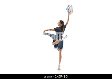 Happy woman in dress, employee with documents feeling happy, smiling and dancing, celebrating successful project isolated on white background Stock Photo