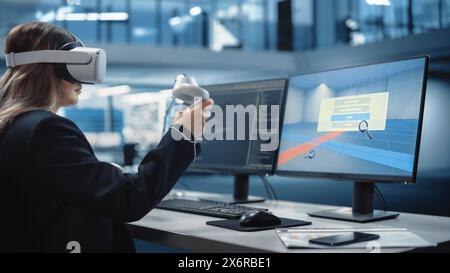 Interior Designer Using a Virtual Reality 3D Software to Work on Home Design and Furniture in Interactive Environment in Agency Office. Female Designer Using Headset and Controllers. Stock Photo