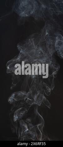 Real gray smoke lines isolated on black studio background Stock Photo