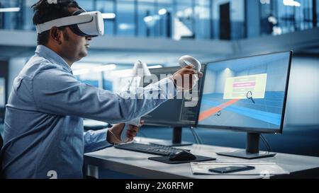 Industrial Software Developer Writing Code and Testing 3D Interior Design Interface. Engineer Editing and Moving Furniture while Wearing Virtual Reality Headset and Using Controllers. Stock Photo