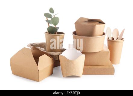Eco friendly food packagings, wooden cutlery and eucalyptus leaves isolated on white Stock Photo