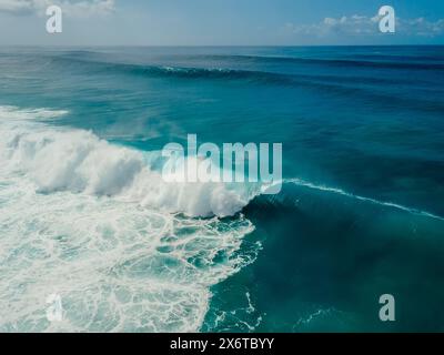 Perfect glassy wave with barrel in blue ocean. Surfing waves. Aerial view Stock Photo
