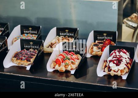 Brussels, Belgium - October 21, 2023: Traditional Belgian waffles with different toppings Stock Photo