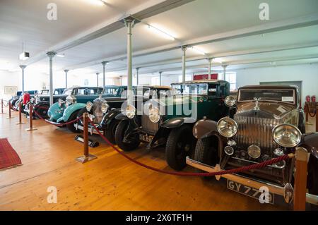 Rolls-Royce Museum in Dornbirn. Tightly parked vintage cars in a building of former factory Stock Photo