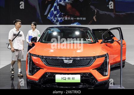 Wuhan, China. 16th May, 2024. Visitors visit the Cadillac stand at the 2024 Central China International Auto Show. The Biden Administration has announced new tariffs on Tuesday for Chinese made electric vehicles, quadrupling the current tariff from 27.5% to 102.5%, as well as new tariffs on solar cells, steel, and aluminum. (Photo by RenYong/SOPA Images/Sipa USA) Credit: Sipa USA/Alamy Live News Stock Photo