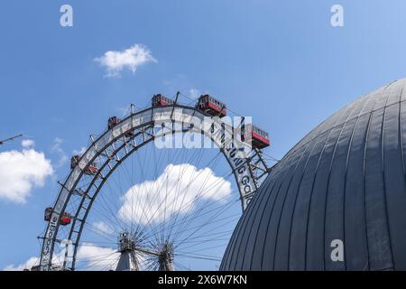 Ferris wheel against blue sky and clouds in Vienna, Austria Stock Photo