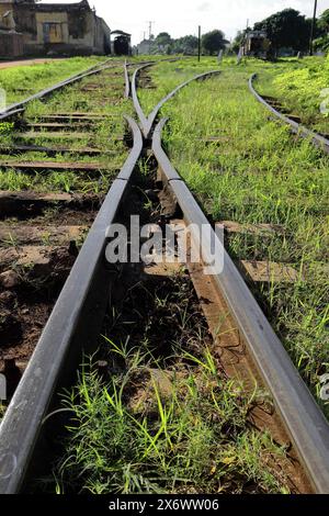 293 Three railroad tracks intertwining on a turnout at the main station, beginning of the siding for retired old locomotives. Trinidad-Cuba. Stock Photo