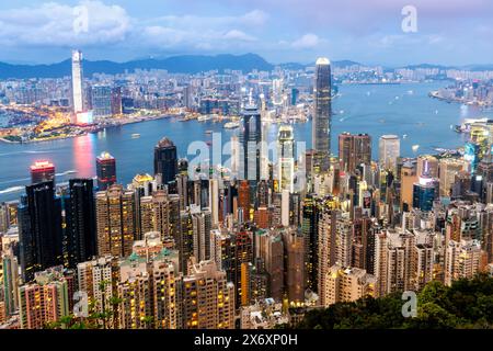 Hong Kong, China - April 4, 2024: Hong Kong Skyline With Skyscrapers Downtown In The Evening In Hong Kong, China. Stock Photo