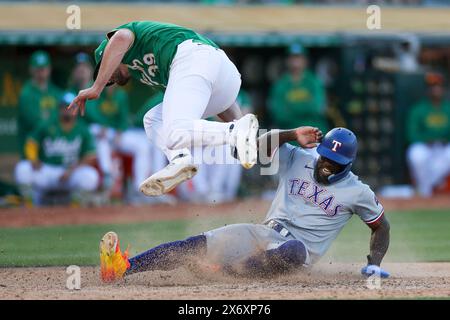 Kyle Muller #39 of the Oakland Athletics tags out Adolis Garcia #53 of the Texas Rangers in the eighth inning during game 2 of a doubleheader at Oakla Stock Photo