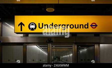 London, UK - March 22, 2024; Illuminated direction sign for London Underground transportation sysyem Stock Photo