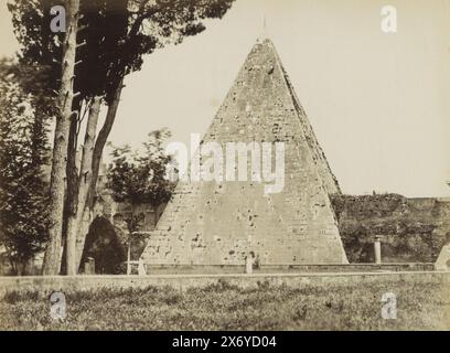 Exterior of the Pyramid of Cestius in Rome, Piramide di Caio Cestio ROMA (title on object), Part of Travel album with photos of sights in Italy (part I)., photograph, anonymous, Rome, c. 1865 - c. 1890, paper, albumen print, height, 190 mm × width, 246 mm Stock Photo