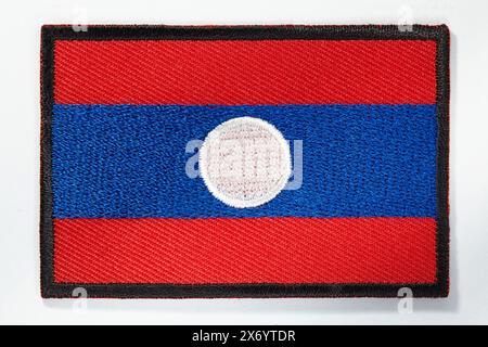 Laos national flag embroidered emblem on white background Stock Photo