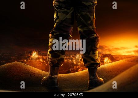 Soldier feet with military boots standing with fire and explosion on war scene background Stock Photo