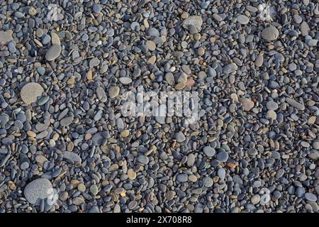 Sea stones background with small pebbles or stone in garden or in the seaside or on a beach. Stock Photo