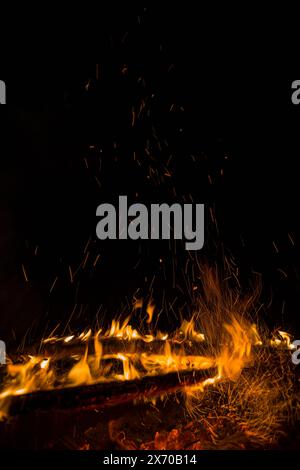fire flames with sparks on a black background Stock Photo