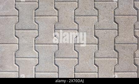 interlocking block paving floor background beige grey demo example Stock Photo