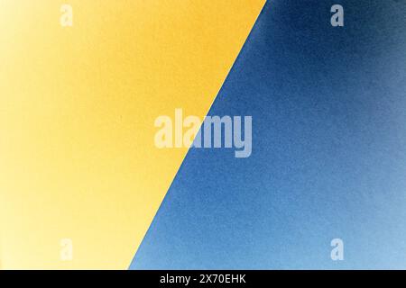Abstract background. Photo is divided in half diagonally into two colors. Blue and yellow. Colors have gradient. In the upper right corner they are da Stock Photo